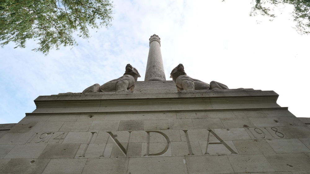 "INDIA" inscription on the pedestal of the Neuve-Chapelle Indian Memorials central column. Two stylised lion statues sit atop the pedestal.