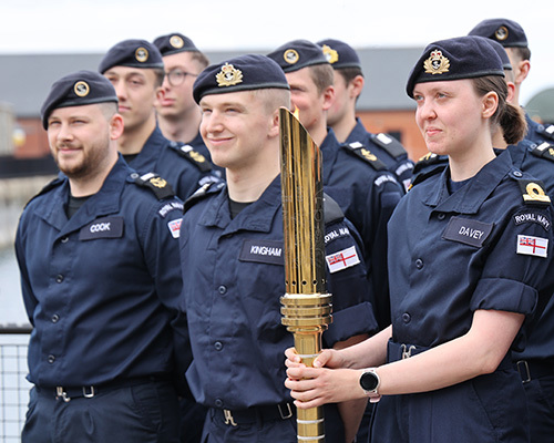 Royal Navy sailors with the Torch For Peace