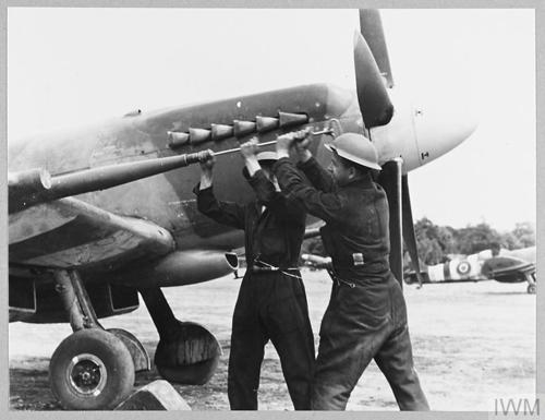 RAF ground crew rush to outfit a fighter plane