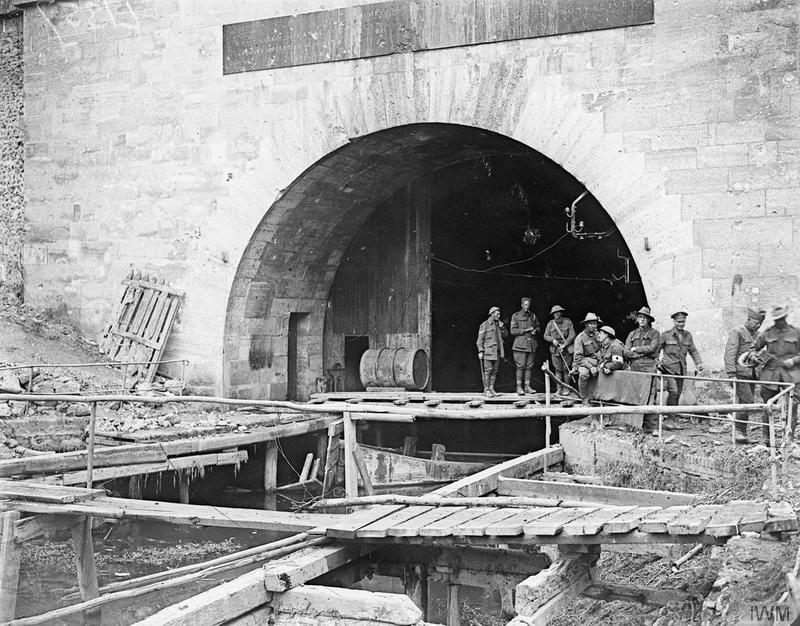 Australian and American WW1 troops meet beneath the arch of the St. Quentin Canal tunnel at Riqueval.